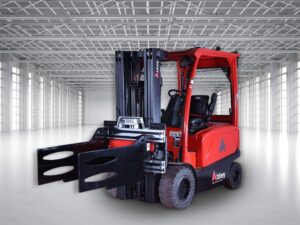 a black Longhe bale clamp is attached to the front of the red abbey forklift truck in a warehouse