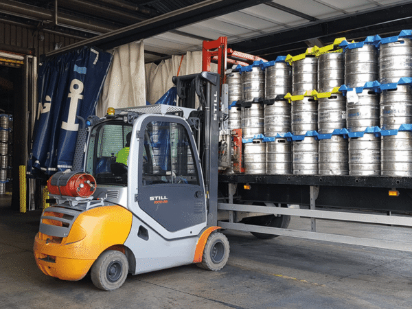 forklift truck at the side of a van retrieving a keg