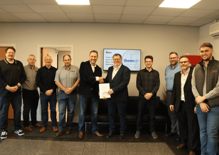 the staff of abbey and and durwen are holding up a partnership agreement
