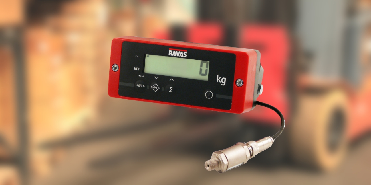 the red ravas safecheck system is on a blurred background of an image of the ravas icp on a forktruck