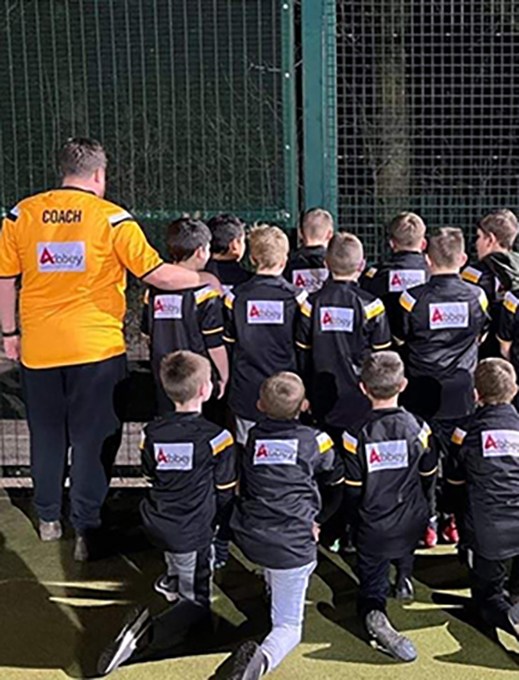 the junior boy ashton bears rugby league squad can be seen posing for a team photo on a 3G pitch
