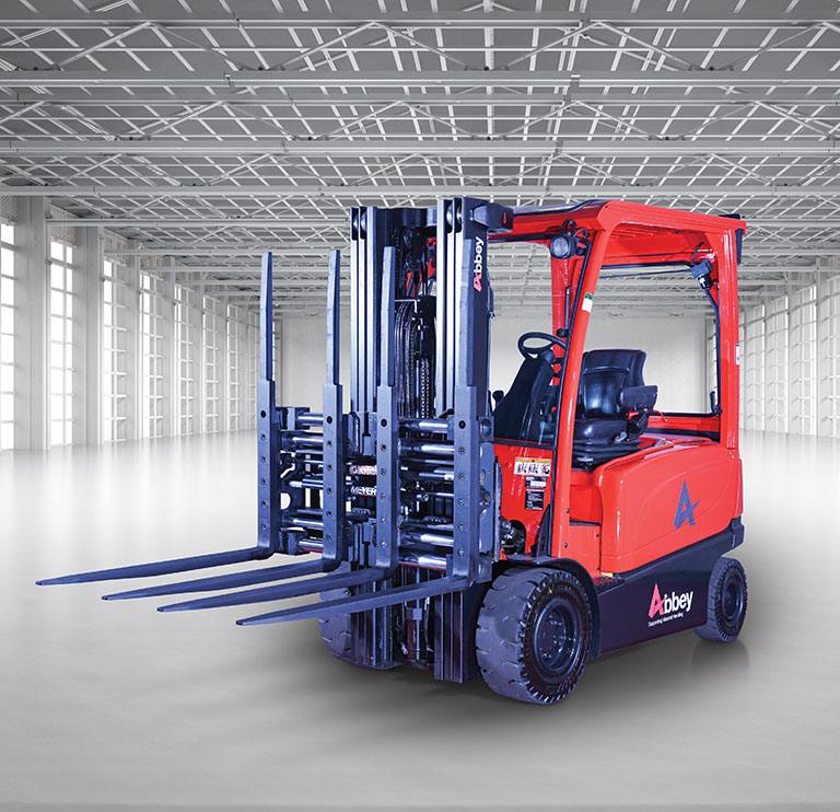 an abbey forktruck with a double pallet handler is in the middle of an empty, white warehouse