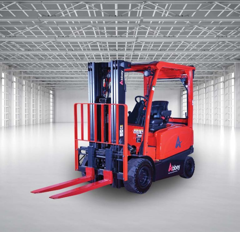 an abbey forktruck with red weighing forks is in the middle of an empty, white warehouse