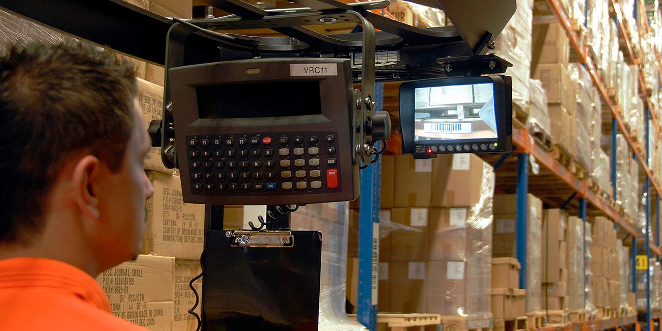 A forklift safety camera monitor is positioned within a forklift truck while and operator looks at it